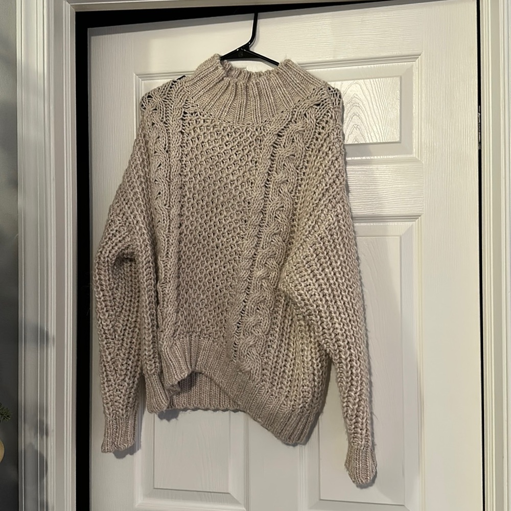 Tan winter sweater. Size: Medium.